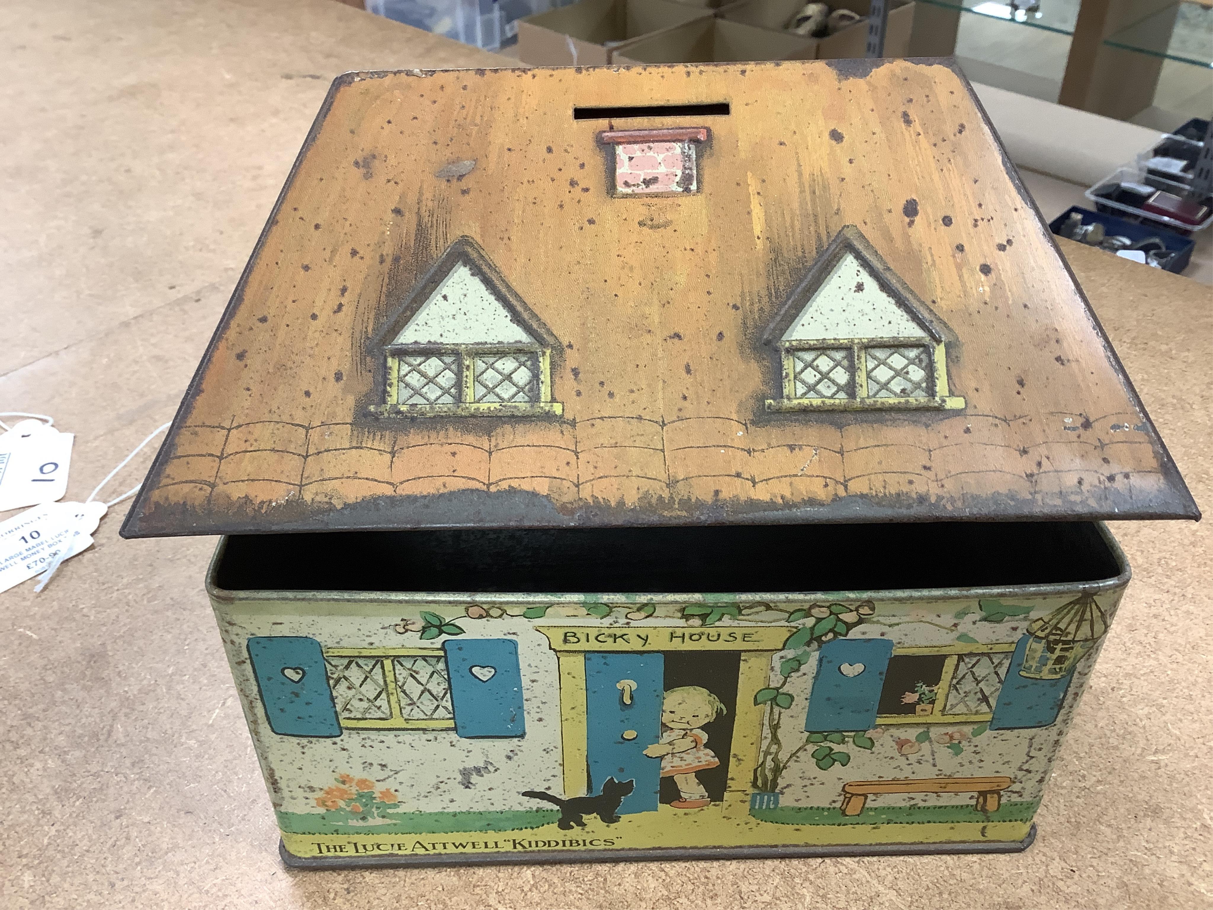 A quantity of various painted tin money boxes including Lucie Attwell Fairy House, The ‘Daily Mail’ copper bank, and four in the form of books, largest 20cm high. Condition - mostly fair